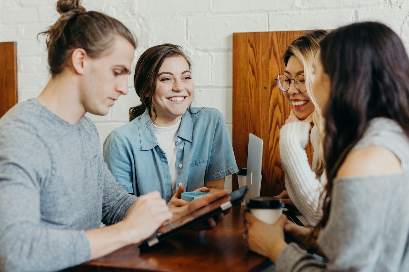 A team smiling together in a meeting